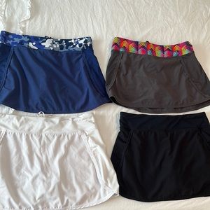 4 Fabletics tennis skirts with liner, waist drawstring, back key pocket